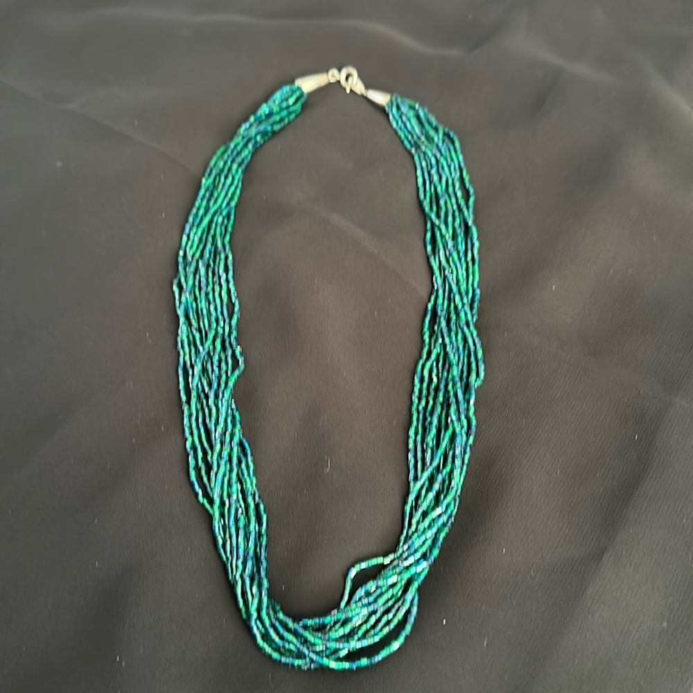 Blue and green strands of tiny beads necklace.
